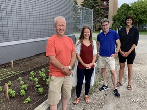 (Left to right) Lawson Sales' Tracy Jensen, Winnipeg Food Council Coordinator Jeanette Sivilay, Coun. Brian Mayes (St. Vital) and local volunteer Lindsay Smith at the unveiling of the Meadowood Victory Garden at the St. Vital Arena in Winnipeg on Saturday.