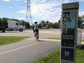 A cyclist on Bishop Grandin Greenway Trail off Bishop Grandin Boulevard at River Road in the St. Vital area of Winnipeg on Tuesday, June 23, 2020.
