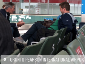 Manitoba Premier Brian Pallister talks to federal Tory leader Andrew Scheer in a mandatory mask area of Toronto's Pearson International Airport. @canadiandollaz/Twitter