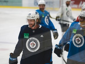 Winnipeg Jets forward Jansen Harkins (58) catches his breath during Winnipeg Jets training camp at the Iceplex on Sunday, July 19, 2020.