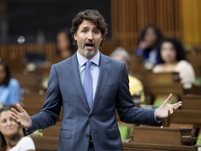 Prime Minister Justin Trudeau rises during a sitting of the Special Committee on the COVID-19 Pandemic in the House of Commons Wednesday July 22, 2020 in Ottawa.