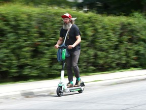 An e-scooter zips down a Calgary road. On Tuesday, the Infrastructure Renewal and Public Works committee voted to make a formal request to the province to approve the trial, which would allow e-scooters to legally operate on the city’s transportation network – similar to Calgary’s e-scooter (micromobility) trial.