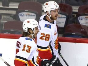 Johnny Gaudreau (left) and Elias Lindholm skate to the bench during a Calgary Flames intrasquad game at the Saddledome in Calgary on Tuesday, July 21, 2020. Jim Wells/Postmedia