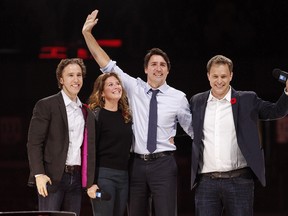 Canada's Prime Minister Justin Trudeau and his wife Sophie Gregoire-Trudeau are flanked by We Day co-founders Craig Kielburger, left, and Marc Kielburger, right.