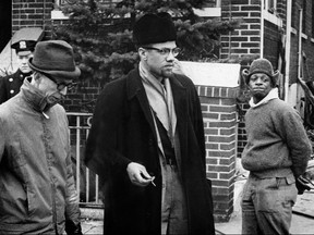 Undated picture of Malcolm X, centre, the leader of the Organization for the Afro-American unity.