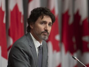 Prime Minister Justin Trudeau listens to a question during a news conference, Wednesday, July 8, 2020 in Ottawa.