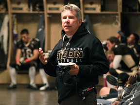 University of Manitoba Bisons head coach Brian Dobie gives his pre-game speech at Investors Group Field before taking on the University of Regina Rams in their homecoming game in Winnipeg on Fri., Oct. 2, 2015.