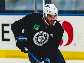 Jets forward Adam Lowry takes part in the team's workout at a practice rink in Edmonton on July 27, 2020.