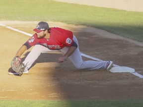 Goldeyes first baseman Kyle Martin stretches to catch a throw during a game last week in Fargo, N.D. Even though he is an excellent defensive player, he continues to work on his craft before American Association games.