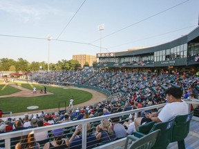 Spectators followed social distancing guidelines with spaces between groups last night as the Winnipeg Goldeyes faced the Fargo-Moorhead RedHawks in their season opener on July 3, 2020, at Newman Outdoor Field in Fargo, N.D.