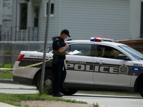 Police officers investigate a fatal shooting in the vicinity of Salter Street and Flora Avenue on Canada Day. A 14-year-old boy has been charged with murder and attempted murder in four shootings over a 24-hour period.