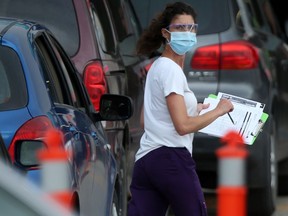 Many vehicles were lined up at the drive through COVID-19 testing facility on Main Street on Friday.