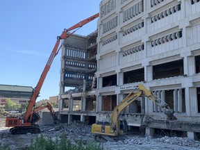 Crews work on the $12 million demolition of the former Public Safety Building and civic centre car park next to Winnipeg City Hall on Friday, July 17, 2020.