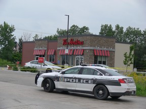A Winnipeg Police cruiser sits at the scene on Friday of a fatal stabbing that occurred on Thursday, at approximately 5:25 p.m., in a parking lot of a Tim Hortons restaurant and Petro-Canada gas bar at the northwest corner of Lagimodiere Boulevard and Fermor Avenue. An adult male was transported to hospital in critical condition but later died from his injuries. The victim has been identified as 43-year-old Ryan Kelly Legary.
