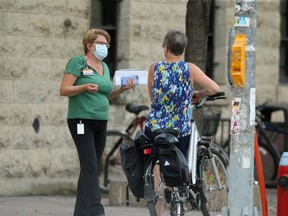 People wearing masks in public during COVID-19 pandemic on Friday.