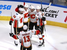Flames forward Elias Lindholm (#28) celebrates one of his team's five power-play goals this series against the Jets.