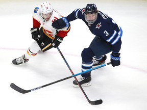 Jets' Tucker Poolman returned to Tuesday's game after blocking a shot with his face.