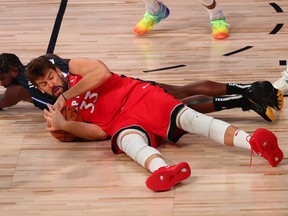 Raptors' Marc Gasol fights for a loose ball with Orlando's James Ennis III this week.