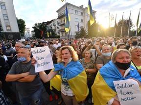 Activists of "Movement Against Surrender" including Ukrainian opposition parties rally outside the President Volodymyr Zelensky office in Kiev, on July 27, 2020, during their protest against the next ceasefire with separatists fighting in the Donetsk and Lugansk regions. - Moscow-backed separatists on July 27, 2020, breached a tense ceasefire in eastern Ukraine just hours after it began, the Ukrainian army said, but the separatists denied the accusation. The ceasefire came into force from midnight Sunday and had been agreed last week by negotiators from Ukraine, Russia and the international monitor group OSCE. (Photo by Sergei SUPINSKY / AFP) (Photo by SERGEI SUPINSKY/AFP via Getty Images)