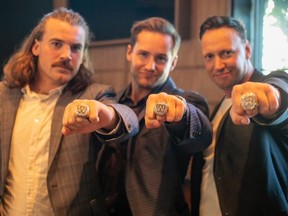 (Left to right) Winnipeg Blue Bombers John Rush, Thomas Miles and Chad Rempel show off their Grey Cup rings in Winnipeg on Thursday, Aug. 7, 2020.