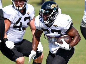 Jacksonville Jaguars running back Leonard Fournette runs with the ball during training camp at Dream Finders Homes Practice Complex.
