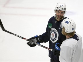 Dylan DeMelo (left) chats with Kyle Connor during Winnipeg Jets summer training camp on Wed., July 22, 2020. Kevin King/Winnipeg Sun/Postmedia Network