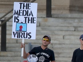 Ant science demonstrators and members of the local Iraqi community intersected briefly while gathering for different reasons, on the grounds of the Manitoba Legislature , in Winnipeg today,  The anti science group was also anti media. Saturday, August 29/2020.