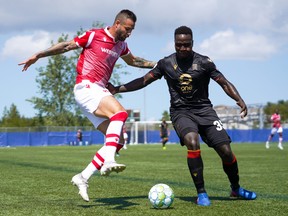 Cavalry FC Marcus Haber (L) is marked by Valour FC Andrew Jean-Baptiste during their game last month.