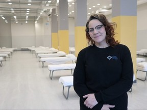 Adrienne Dudek, director of supportive and transitional housing for Main Street Project, unveils their new shelter at 637 Main Street on Friday, Sept. 18, 2020 in Winnipeg. The shelter currently has 120 beds but will be expandable in the short and long term.