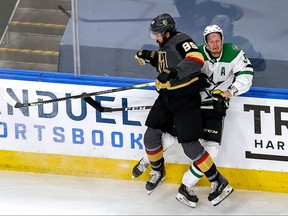 John Klingberg, right, of the Dallas Stars is checked by Alex Tuch of the Vegas Golden Knights during the first period in Game 1 of the Western Conference Final during the 2020 NHL Stanley Cup Playoffs at Rogers Place on Sept. 6, 2020 in Edmonton.