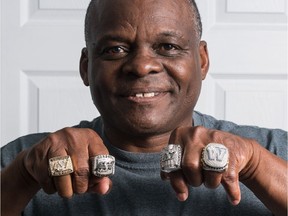 Current Winnipeg B;ue Bomber defensive co-ordinator Richie Hall shows off the four Grey Cup rings he's won over his 37-year CFL career.