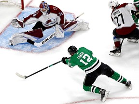 Sep 2, 2020; Edmonton, Alberta, CAN; Dallas Stars center Radek Faksa (12) shoots the puck against Colorado Avalanche goaltender Michael Hutchinson (35) during the first period in game six of the second round of the 2020 Stanley Cup Playoffs at Rogers Place. Mandatory Credit: Perry Nelson-USA TODAY Sports ORG XMIT: USATSI-430383