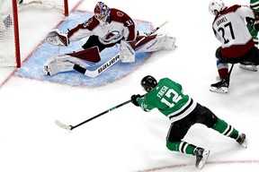 Sep 2, 2020; Edmonton, Alberta, CAN; Dallas Stars center Radek Faksa (12) shoots the puck against Colorado Avalanche goaltender Michael Hutchinson (35) during the first period in game six of the second round of the 2020 Stanley Cup Playoffs at Rogers Place. Mandatory Credit: Perry Nelson-USA TODAY Sports ORG XMIT: USATSI-430383