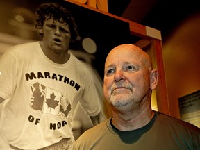Fred Fox, Terry Fox’s older brother, stands beside a poster of his brother at the Telus World of Science in Edmonton on June 3, 2018 where the exhibit “Terry Fox: Running to the Heart of Canada” is on display. The 38th Annual Terry Fox Run will take place on Sunday, September 16, 2018.