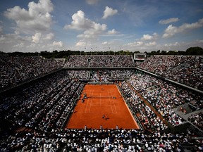 In this file photo taken on June 8, 2018 spectators watch Rafael Nadal as he plays Juan Martin del Potro during their semifinal during the French Open in Paris.