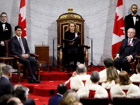 Canada's Governor General Julie Payette delivers the Throne Speech next to Prime Minister Justin Trudeau and Government Representative in the Senate Peter Harder, in the Senate, as parliament prepares to resume for the first time after the election in Ottawa, Ontario, Canada December 5, 2019.