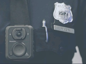 Winnipeg became the latest city in North America to decide against arming police with cameras. A Newark, N.J. police officer displays how a body cam is worn at the Panasonic headquarters in 2017.