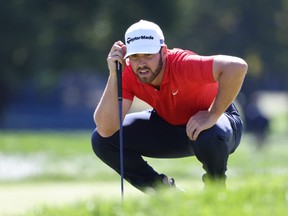 American Matthew Wolff lines up a putt on the first green during the third round of the U.S. Open on Saturday. The young American takes a two-stroke lead into the final round on Sunday at Winged Foot Golf Club in Mamaroneck, N.Y.