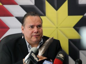 Garrison Settee, Grand Chief of Manitoba Keewatinowi Okimakanak, holds a feather during a press conference at its office on Portage Avenue in Winnipeg to discuss measures being taken by northern First Nations to combat the COVID-19 pandemic, on Wed., March 18, 2020. Kevin King/Winnipeg Sun/Postmedia Network