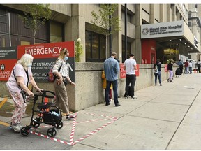 CP-Web. People wait in line for hours at a COVID assessment centre at Mount Sinai Hospital during the COVID-19 pandemic in Toronto on Thursday, Sept. 24, 2020.
