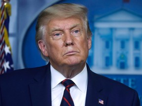 U.S. President Donald Trump listens to a question from a reporter during a news conference at the White House in Washington, D.C., Friday, Sept. 4, 2020.