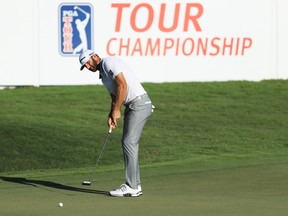 Dustin Johnson of the United States putts on the 18th green during the second round of the Tour Championship at East Lake Golf Club on Sept. 5, 2020 in Atlanta, Ga.
