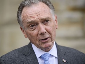 Conservative MP Peter Kent speaks to reporters on Parliament Hill in Ottawa on Wednesday, July 22, 2020.