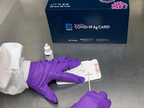 This handout photo shows Abbott's BinaxNOW COVID-19 Ag Card, a rapid, reliable, highly portable, and affordable tool for detecting active coronavirus infections at massive scale.