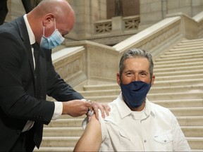 Premier Brian Pallister and Chief Provincial Public Health Officer Dr. Brent Roussin kick off the province's annual flu shot campaign at the Manitoba Legislature on Thursday, Oct. 15. 2020. Josh Aldrich/Winnipeg Sun