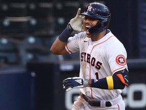 Carlos Correa of the Houston Astros celebrates while rounding the bases after hitting a walk off solo home run to beat the Tampa Bay Rays 4-3 in Game 5 of the American League Championship Series at PETCO Park on Oct. 15, 2020 in San Diego, Calif.