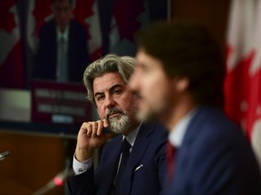 Leader of the Government in the House of Commons Pablo Rodriguez looks towards Prime Minister Justin Trudeau as they take part in a press conference during the COVID pandemic in Ottawa on Friday, Oct. 16, 2020.