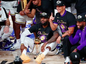 The Los Angeles Lakers pose for a photo after winning the NBA championship.