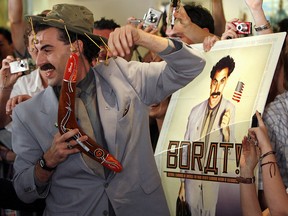 British actor Sacha Baron Cohen, in character as Borat, holds a boomerang as he mingles with fans in Sydney November 13, 2006.