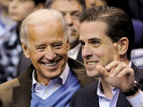 U.S. Vice-President Joe Biden and his son Hunter attend an NCAA basketball game between Georgetown University and Duke University in Washington, D.C., Jan. 30, 2010.